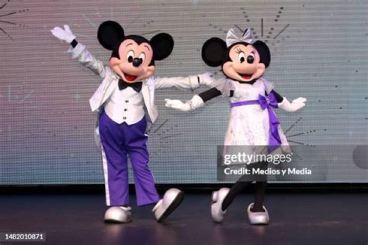 Actors dressed as Walt Disney characters Mickey Mouse (L) and Minnie Mouse (R) perform during a press preview for the "Minnie Besties Bash!" parade