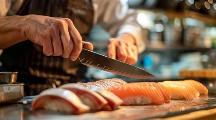 chef slicing fish