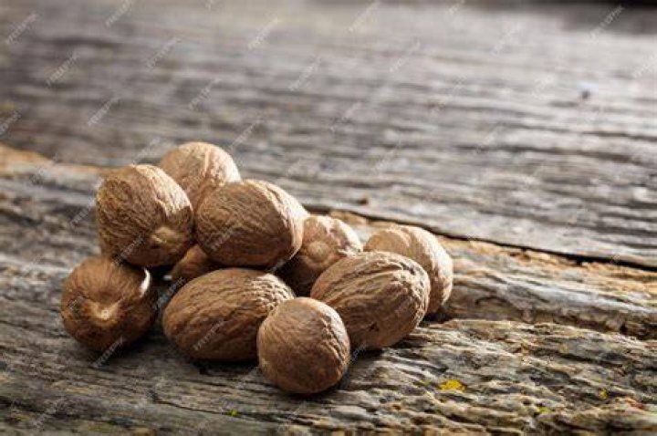 Nutmeg on a wooden surface Nutmeg on a wooden surface